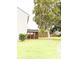 Expansive backyard with lush grass, mature trees, and screened porch at 9229 N Moreto Cir, Summerville, SC 29485