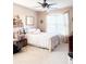Comfortable bedroom features a ceiling fan, natural light, and stylish decor at 9229 N Moreto Cir, Summerville, SC 29485