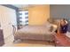 Comfortable bedroom with contrasting colors, ample natural light, and traditional furnishings at 9229 N Moreto Cir, Summerville, SC 29485