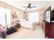 Inviting bedroom with neutral tones, large window, and mounted TV at 9229 N Moreto Cir, Summerville, SC 29485