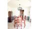 Formal dining room with a wooden table and view into the kitchen at 9229 N Moreto Cir, Summerville, SC 29485