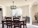 Elegant dining room with stylish light fixture and seating for six at 9229 N Moreto Cir, Summerville, SC 29485