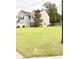 Well-maintained two-story home with a spacious front yard and attached two-car garage at 9229 N Moreto Cir, Summerville, SC 29485