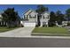 Charming two-story home featuring a two-car garage, well-manicured lawn, and traditional architectural details at 9229 N Moreto Cir, Summerville, SC 29485