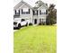 Well-manicured lawn accentuates this beautiful two-story home with attached garage at 9229 N Moreto Cir, Summerville, SC 29485