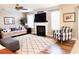 Comfortable living room featuring a fireplace, plush seating, and a ceiling fan at 9229 N Moreto Cir, Summerville, SC 29485