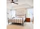 Spacious main bedroom with tray ceiling, neutral carpet, windows dressed with white curtains, and ceiling fan at 9229 N Moreto Cir, Summerville, SC 29485