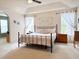Spacious main bedroom with tray ceiling, neutral carpet, and windows dressed with white curtains at 9229 N Moreto Cir, Summerville, SC 29485