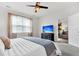 Bedroom featuring a ceiling fan, TV, and view to the living room at 9712 Fanning Basket Ln, Ladson, SC 29456