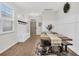 Dining area featuring a rustic table with bench seating, wainscoting, and stylish decor at 9712 Fanning Basket Ln, Ladson, SC 29456