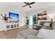Cozy living room with a large sectional sofa, entertainment center, and access to outdoor space at 9712 Fanning Basket Ln, Ladson, SC 29456