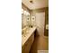 Bathroom featuring a wide vanity, ceramic tile flooring, and a door to the outside at 101 Fresh Meadow Ln, Mount Pleasant, SC 29466