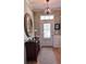 Elegant foyer with a decorative mirror, wood floors, and stylish light fixture at 101 Fresh Meadow Ln, Mount Pleasant, SC 29466