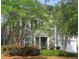 Two-story home with a covered entryway, lots of windows, and a two-car garage at 101 Fresh Meadow Ln, Mount Pleasant, SC 29466