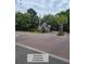 A gated entry guardhouse with beautiful landscaping ensures security and exclusivity for residents of the community at 101 Fresh Meadow Ln, Mount Pleasant, SC 29466