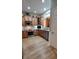 Bright kitchen featuring wood cabinets, stainless steel appliances, and wood floors at 101 Fresh Meadow Ln, Mount Pleasant, SC 29466