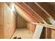 Unfinished attic space, offering potential for storage or customization with exposed wood beams at 106 Chedburg Dr, Goose Creek, SC 29445