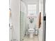 Clean bathroom featuring a toilet, striped shower curtain, and natural light from the window at 106 Chedburg Dr, Goose Creek, SC 29445