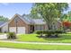 Charming brick home with two-car garage, well-manicured lawn, and mature tree in a lush neighborhood at 106 Chedburg Dr, Goose Creek, SC 29445