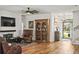Inviting living room featuring a brick fireplace, wood floors, built-in bookcase, and plenty of seating at 106 Chedburg Dr, Goose Creek, SC 29445