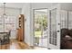 Bright sunroom with French doors, hardwood floors, and views of the backyard patio and lush landscaping at 106 Chedburg Dr, Goose Creek, SC 29445