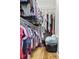 Spacious walk-in closet with ample storage space and wooden floors with lots of hanging clothes at 106 Chedburg Dr, Goose Creek, SC 29445