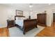 Bedroom featuring a bed, armoire, hardwood floors, a ceiling fan, and natural light at 1061 Law Ln, Mount Pleasant, SC 29464