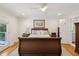 Bright bedroom with wood floors, ceiling fan, crown molding, and backyard view at 1061 Law Ln, Mount Pleasant, SC 29464