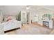 Bright bedroom featuring light hardwood floors, an area rug, and a vanity at 1061 Law Ln, Mount Pleasant, SC 29464