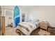 Cozy bedroom featuring a surfboard, natural light, and casual decor elements at 1061 Law Ln, Mount Pleasant, SC 29464