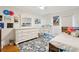 Bright bedroom featuring white furnishings, a floral rug, and a work space at 1061 Law Ln, Mount Pleasant, SC 29464