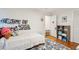 Bright bedroom with a floral rug, hardwood floors, and simple decor at 1061 Law Ln, Mount Pleasant, SC 29464