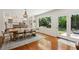 Bright dining room with hardwood floors and an open view to a modern kitchen at 1061 Law Ln, Mount Pleasant, SC 29464