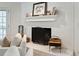 Close up of the decorative fireplace with white painted brick, mantel and hearth at 1061 Law Ln, Mount Pleasant, SC 29464