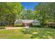 Stunning front exterior of this beautifully landscaped home with mature trees and a circular driveway at 1061 Law Ln, Mount Pleasant, SC 29464