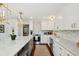 Bright kitchen with marble backsplash, white cabinetry, stainless steel appliances and large center island at 1061 Law Ln, Mount Pleasant, SC 29464