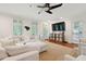 Comfortable living room featuring bright white decor, hardwood floors and a modern fan at 1061 Law Ln, Mount Pleasant, SC 29464