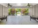 Inviting porch view showcasing lush landscaping and a charming outdoor setting at 1061 Law Ln, Mount Pleasant, SC 29464