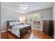 A bedroom with natural light, a ceiling fan, and a hardwood floor at 110 Terry Ave, Summerville, SC 29485