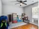 A bright room with hardwood floors and a ceiling fan is currently being used for storage at 110 Terry Ave, Summerville, SC 29485