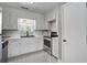 An eat-in kitchen with white cabinets and stainless steel appliances at 110 Terry Ave, Summerville, SC 29485