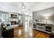 Bright living room featuring hardwood floors, fireplace, and comfortable seating area at 110 Terry Ave, Summerville, SC 29485