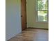 Cozy bedroom featuring wood-look floors and a bright window with outside view at 1101 Stuart Dr, Moncks Corner, SC 29461