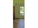 Bright bedroom featuring wood-look floors and a bright window with outside view at 1101 Stuart Dr, Moncks Corner, SC 29461