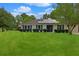 Charming single-story home with solar panels, lush lawn and manicured shrubs at 1101 Stuart Dr, Moncks Corner, SC 29461