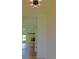 Bright hallway featuring wood floors and a glimpse into the living room with fireplace at 1101 Stuart Dr, Moncks Corner, SC 29461