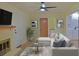 Comfortable living room with fireplace, plush sectional, and view into the kitchen at 1101 Stuart Dr, Moncks Corner, SC 29461