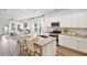 Modern kitchen showcasing stainless steel appliances, granite countertops, and an island with seating at 115 Moscato Ln, Summerville, SC 29485