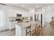 Bright kitchen with an island, stainless steel appliances, granite countertops, and ample cabinet space at 115 Moscato Ln, Summerville, SC 29485