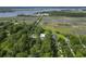 Stunning aerial view of the home featuring lush green landscape and proximity to the water and a creek at 1193 River Rd, Johns Island, SC 29455